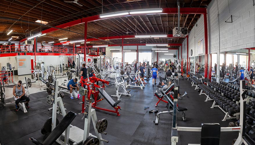 Wide view of the Boulevard Fitness weight room and its mirrored wall