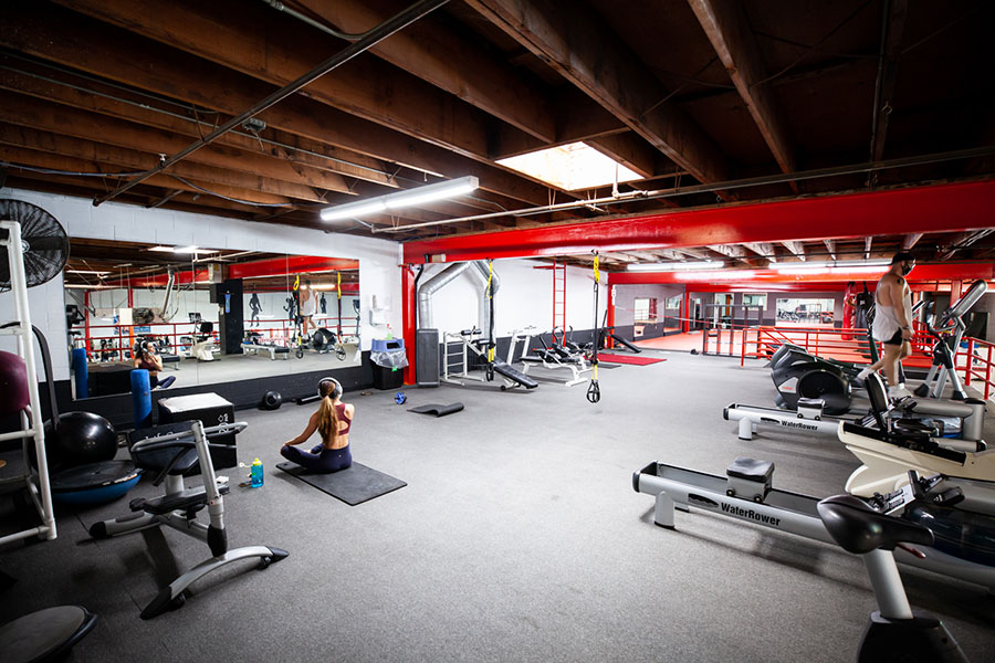 Rowers, turf and a training rig in the Boulevard Fitness conditioning area